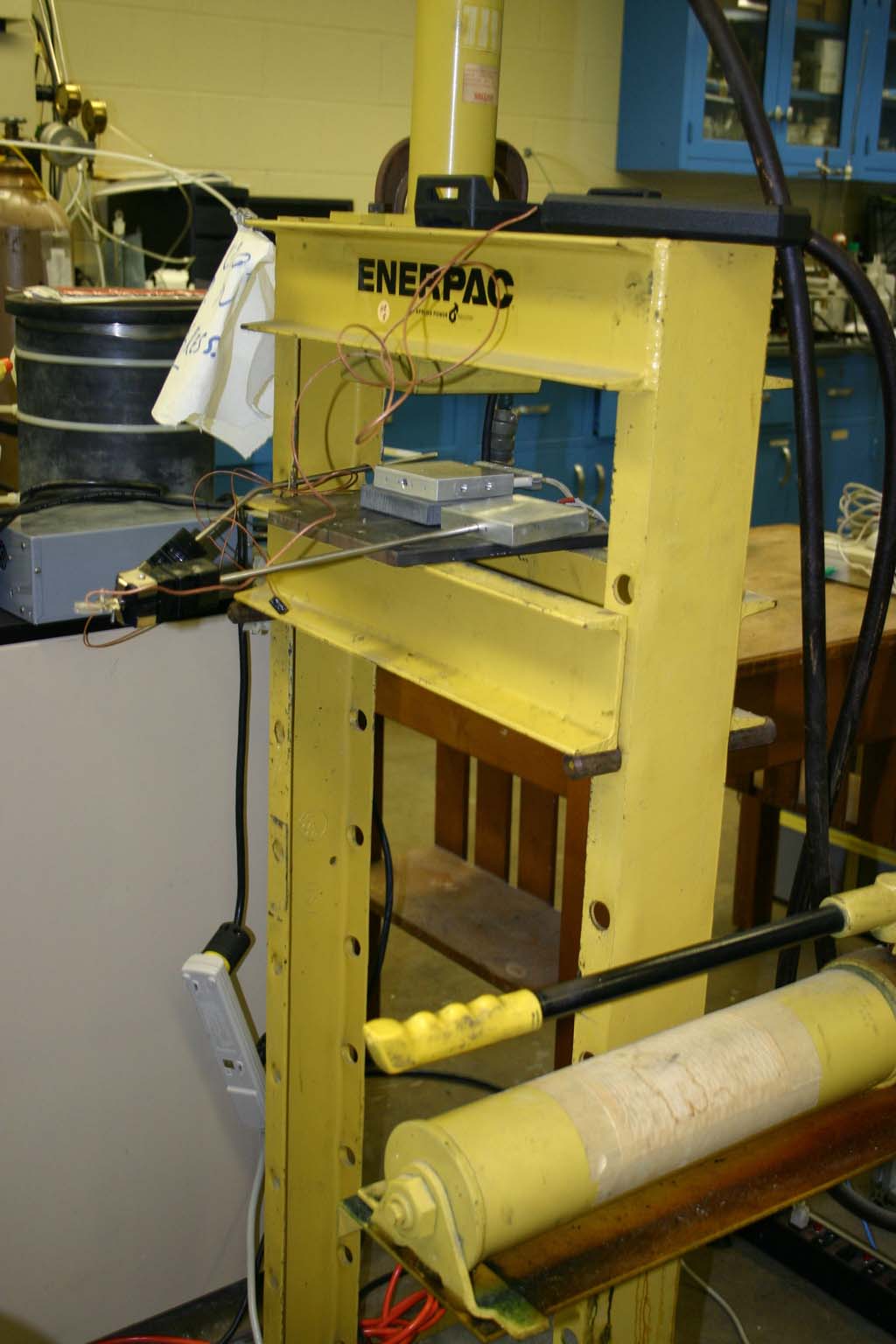 Hand press for membrane electrode assembly compression