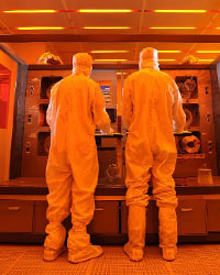 Cleanroom users in safety gowns