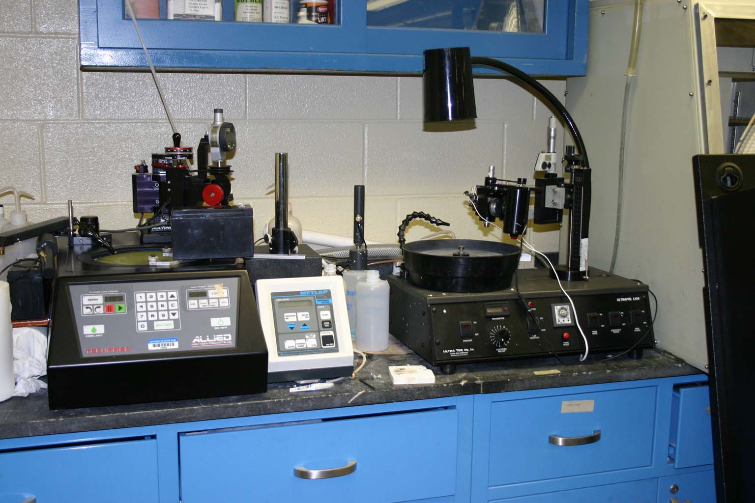 Allied polisher (left), Buehler dispensing system (center), and Modified UltraPol polisher (right) used for precision polishing of crystals and scanning electrochemical microscope tips