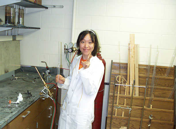 Ara doing some glass-blowing